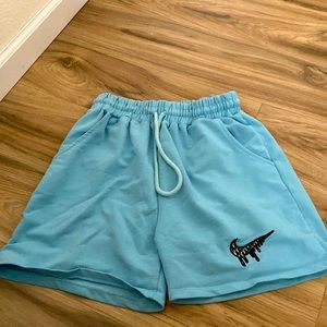 Baby blue Nike drip logo athletic shorts